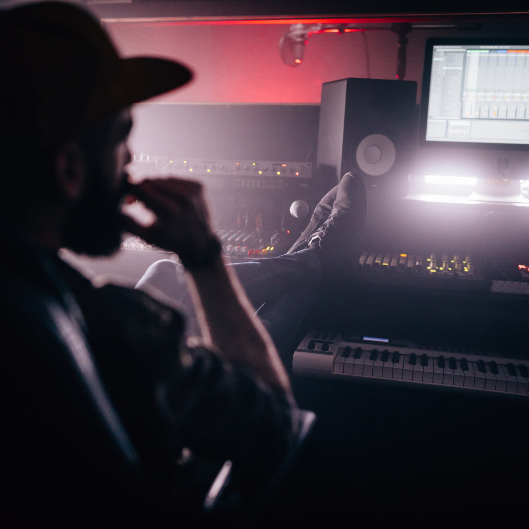 Recording artist sitting in a professional studio 